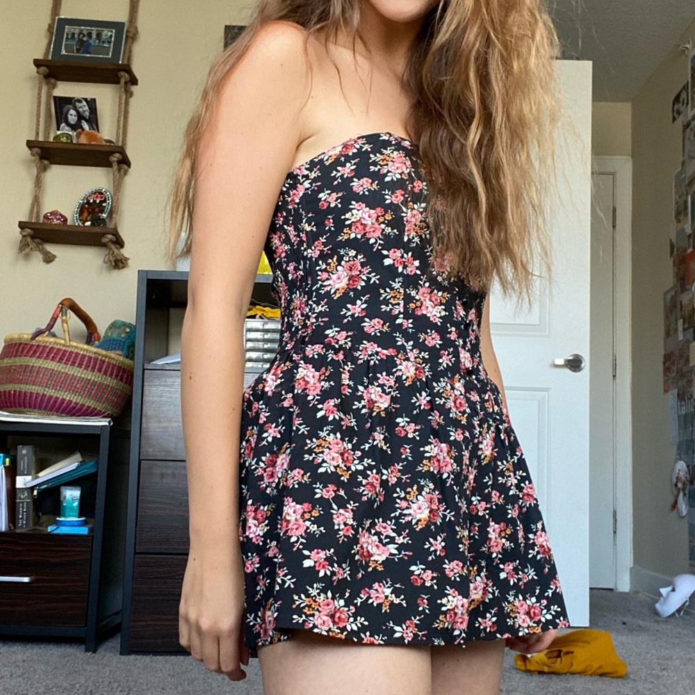 Black romper dress with flowers.